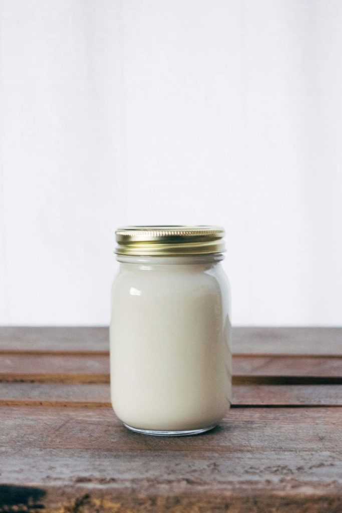 pexels photo 373882 373882 A rustic glass jar filled with creamy yogurt, placed on a wooden table. Ideal for healthy food themes.