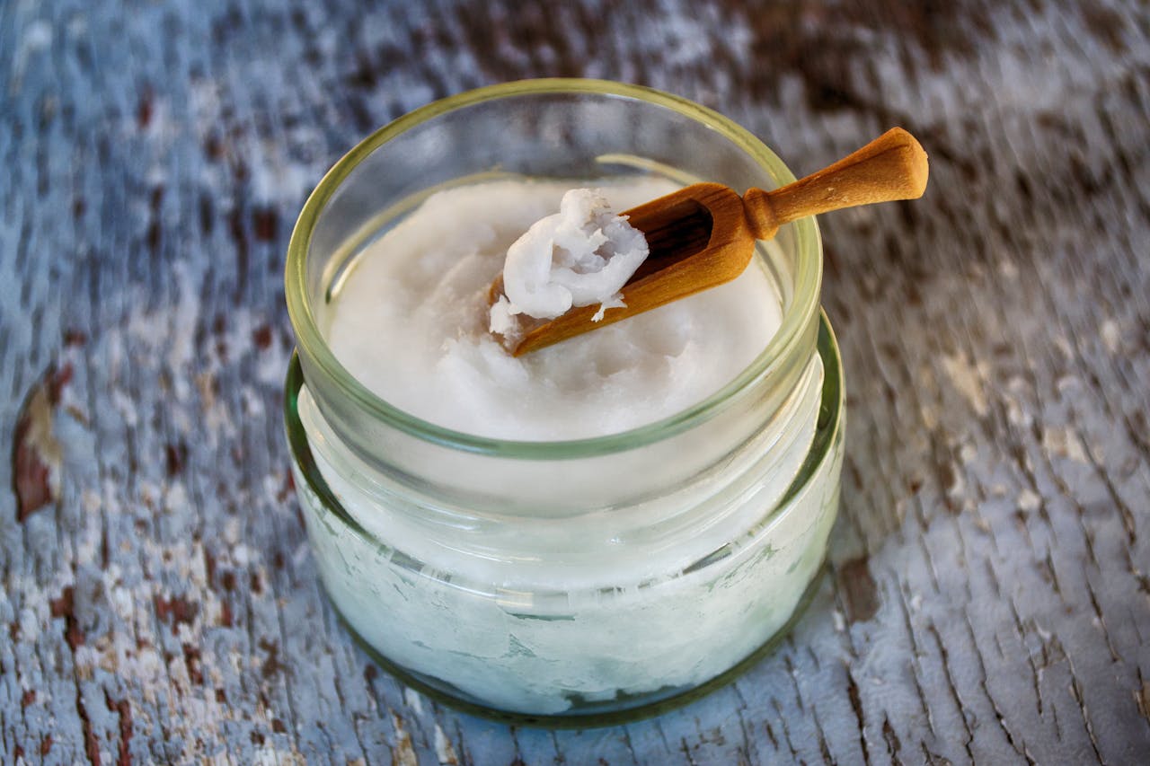 Crafting Captivating Headlines: Your awesome post title goes here Close-up of organic coconut oil in glass jar with wooden spoon, perfect for natural health and wellness use.